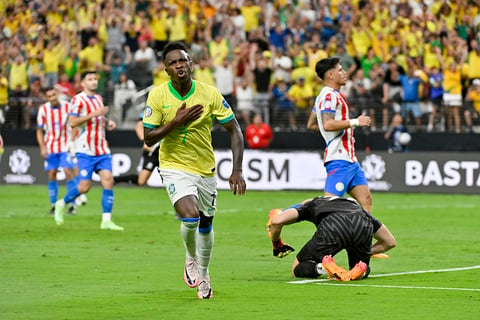 Vinicius Junior celebrates scoring Brazil's opening goal against Paraguay